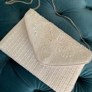Lulus white beaded clutch bag with strap.